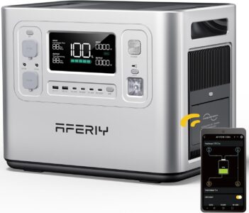 The AFERIY P210 portable power station sitting in the trunk of an adventure vehicle, powering a portable fridge and charging a drone in a forest setting.