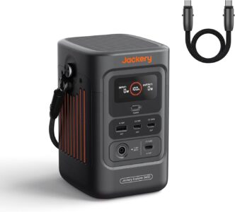 Jackery Explorer 240D Portable Power Station 256Wh LiFePO4 being used at a campsite to charge outdoor gear.
