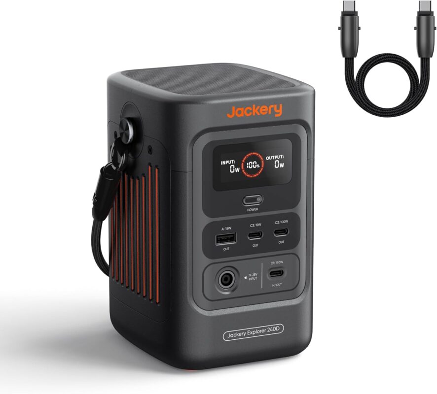 Jackery Explorer 240D Portable Power Station 256Wh LiFePO4 being used at a campsite to charge outdoor gear.