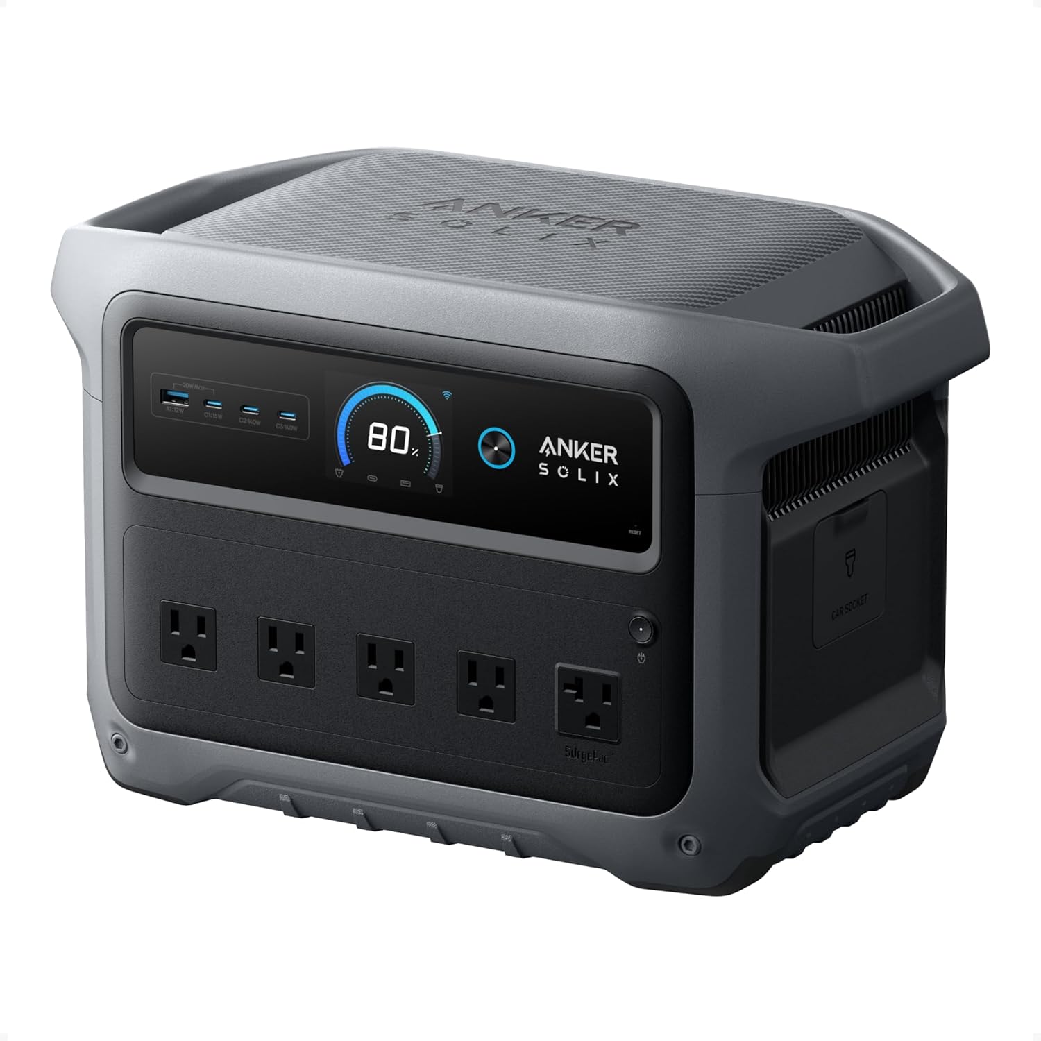 Anker SOLIX C1000 Gen 2 portable power station with LED display showing 100% battery charge on a camping table