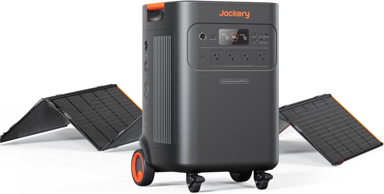 Jackery Solar Generator 5000 Plus power station with solar panels charging in a backyard setting during a power outage