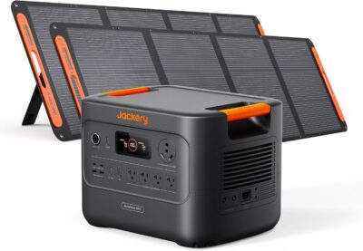 Jackery HomePower 3000 solar generator with two 200W solar panels set up in a backyard for home emergency backup.