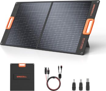 GRECELL 100W foldable portable solar panel set up with kickstands on green grass under bright sunlight, connected to a power station.
