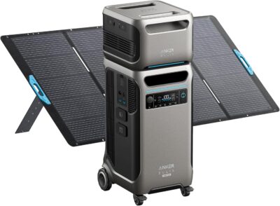 Anker SOLIX F3800 Plus portable power station stacked with BP3800 expansion battery next to a 400W solar panel in a residential driveway.