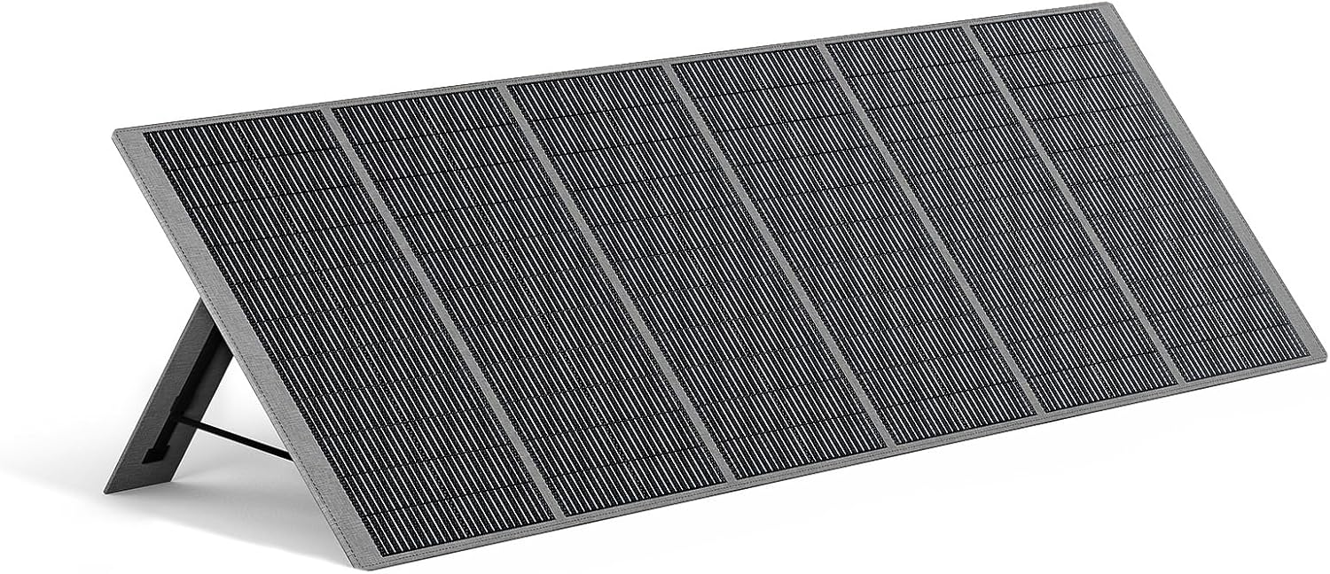 AFERIY 400W foldable portable solar panel deployed in a grassy field next to a camper van, angled toward the sun with its built-in kickstands.