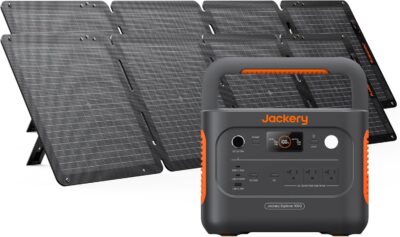 Jackery Solar Generator 1000 v2 power station connected to two SolarSaga 100W panels in a sunny meadow.