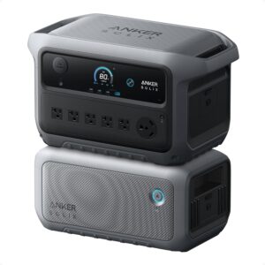 Anker SOLIX C2000 Gen 2 portable power station stacked with its expansion battery in a home garage setup for emergency backup