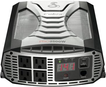 Cobra PRO 2500W professional grade power inverter showing the 4 AC outlets and the digital LCD display in a truck installation.