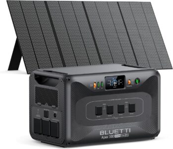 The new 2025 BLUETTI Apex 300 solar generator with its 350W solar panel deployed in a grassy campsite next to a modern camper van.
