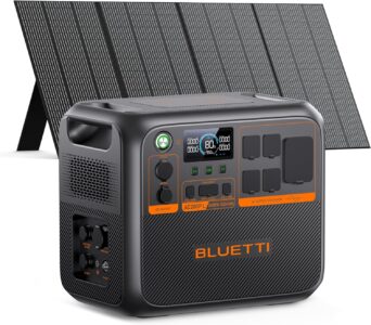 The BLUETTI AC200PL solar generator plugged into a travel trailer using the TT-30 port, with a 350W solar panel standing nearby.